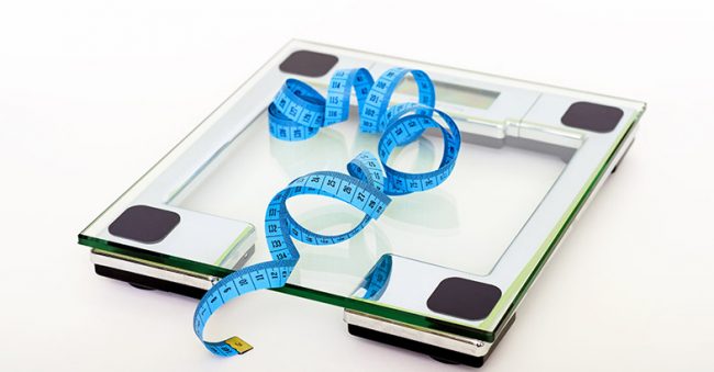 measuring-tape-on-scale-OFW image of measuring tape on a scale