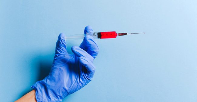 image of gloved handle holding b12 hcg injection