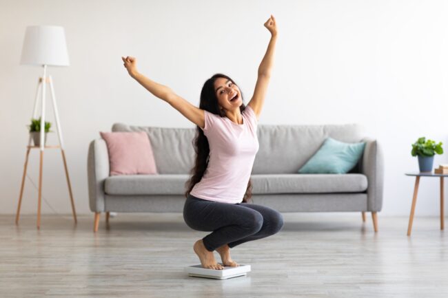 excited woman celebrating the benefits of Rybelsus such as weight loss
